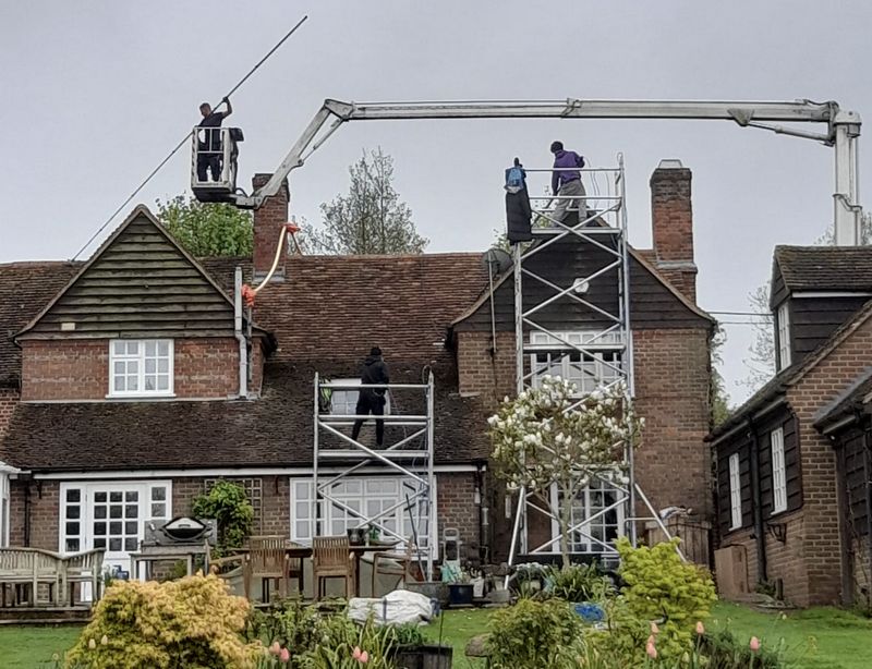 The Moss Cleaners using cherry picker and scaffolding to clean roof safely and professionally in 204 Brigstock Rd, Thornton Heath CR7 7JD, UK, 204 Brigstock Rd, Thornton Heath CR7 7JD, UK